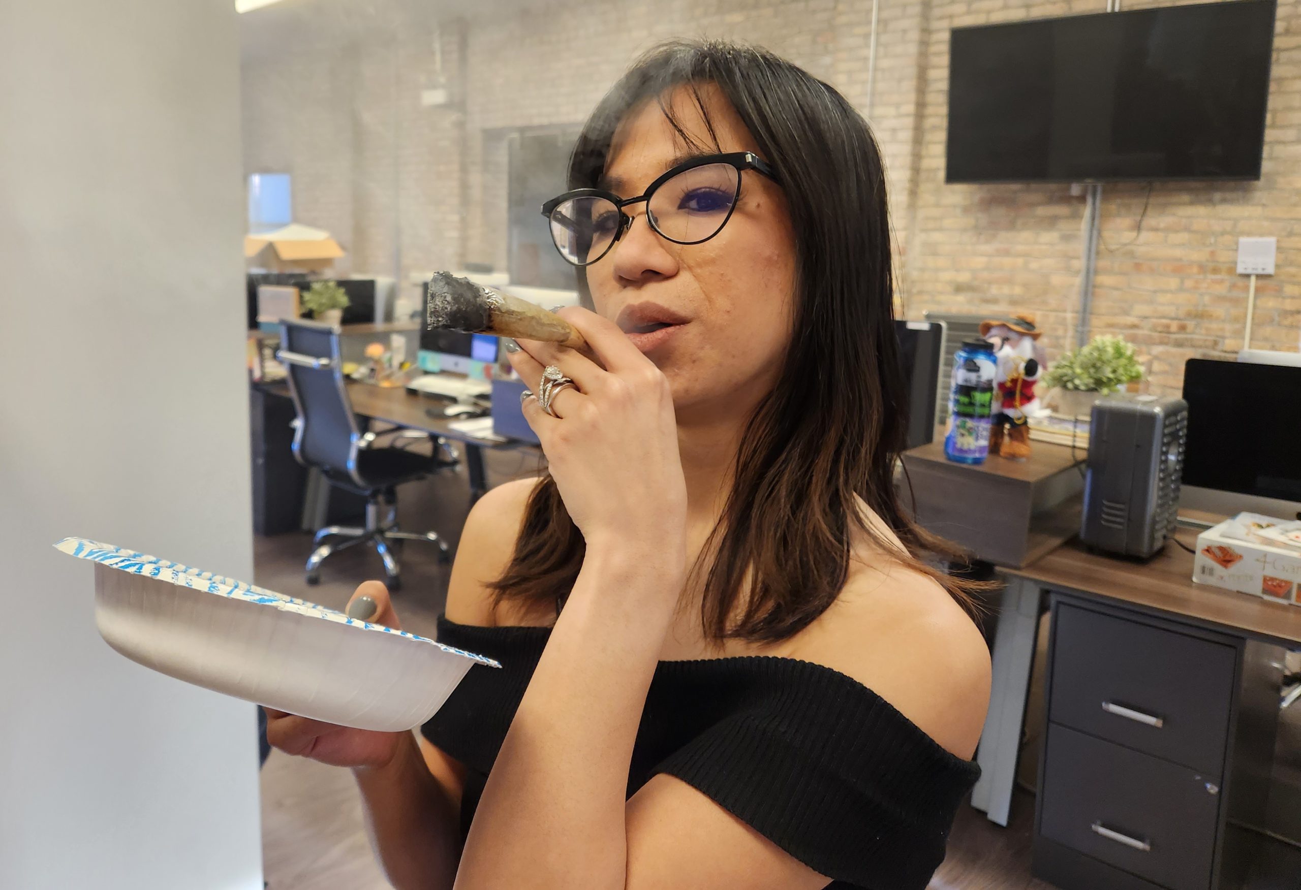 Woman smoking a large joint