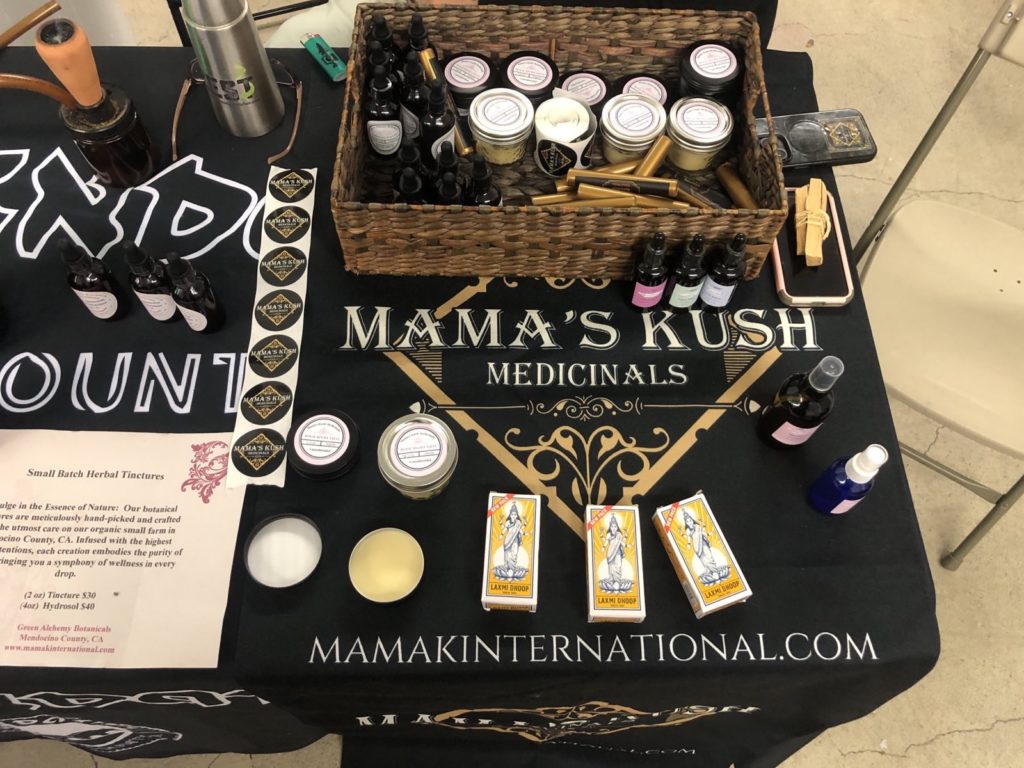 mama k table at lotus entheogenic church pill hill swap.jpeg